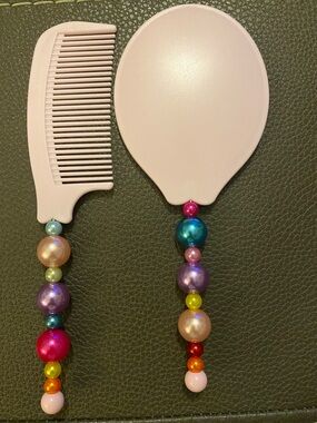 Pink Beaded Handle Hairbrush and Comb Set.